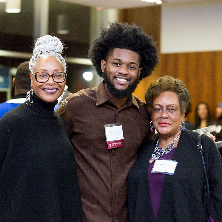 three alumni gather during the Black Student and Alumni Networking Event in 2023.