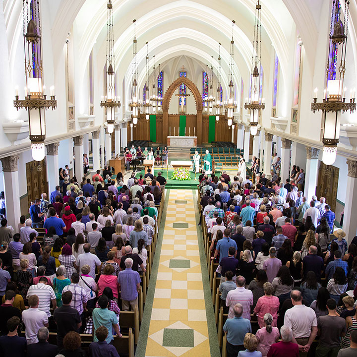 An interior view of Sacred Heart Chapel full during a Mass