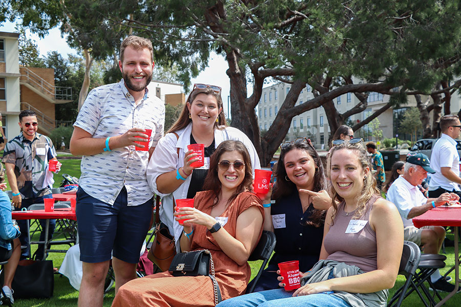 Young alumni gather in Sunken Garden during Alumni BBQ